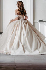 Champagne Satin Ball Gown Wedding Dress Off-the-Shoulder 3D Floral Lace Cap Sleeve Fully 3D Flower Applique Corset Bodice Voluminous Skirt Cathedral Train Bridal Gown