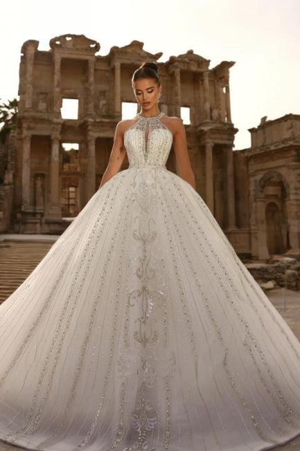 White halter beaded ball gown wedding dress