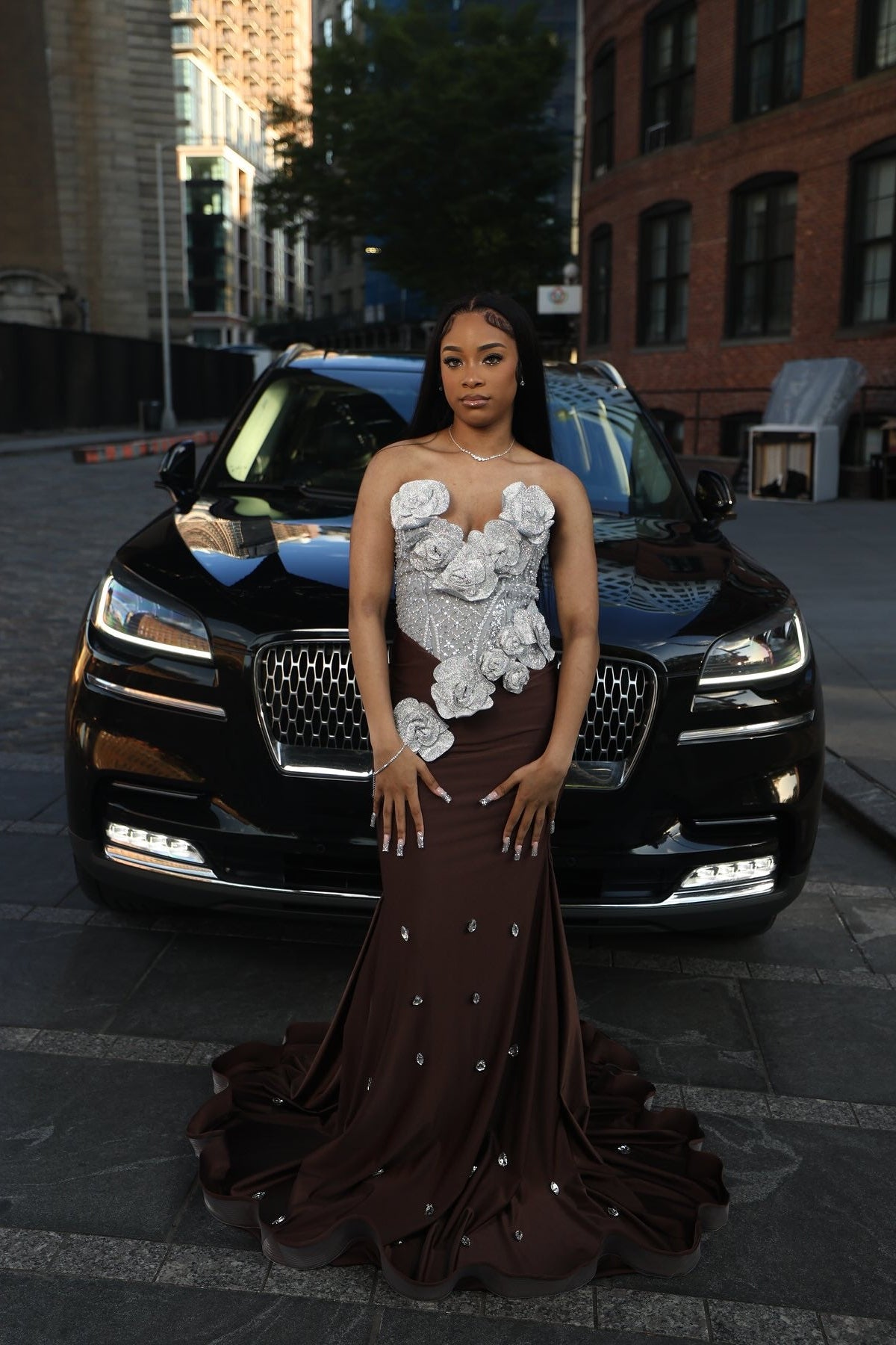 Chocolate Brown Mermaid Prom Dress Strapless Sweetheart Sheer Illusion Heavy Silver Crystal Rhinestone Beading Oversized 3D White Silver Satin Rose Bloom Bodice Scattered Rhinestone Ruffle Hem Sweep Train Gown