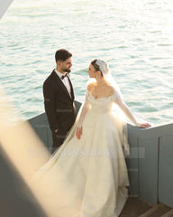 Elegant Ivory Strapless Long-Sleeve Ball Gown Wedding Dress with Chapel Train