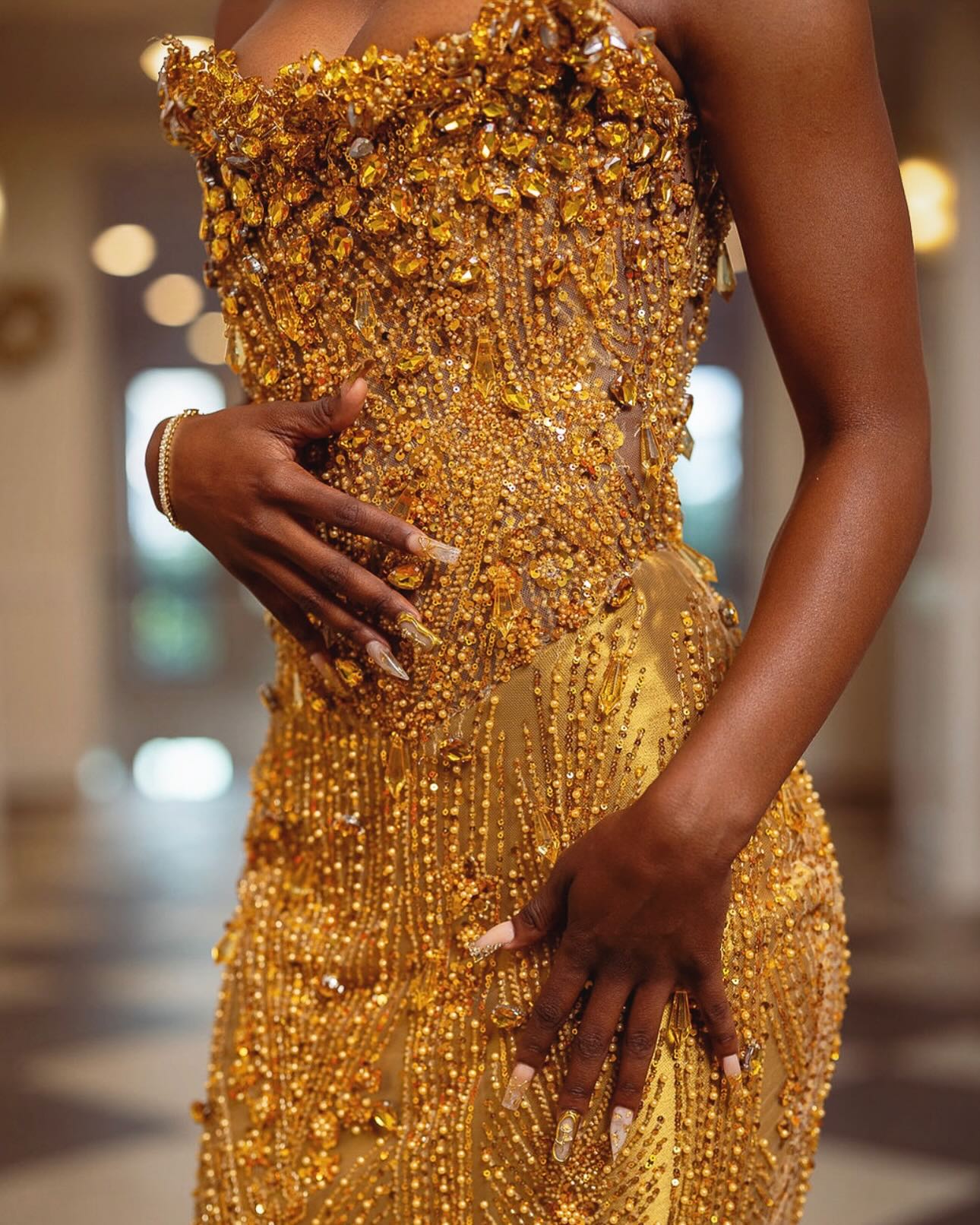 Gold Mermaid Prom Dress Strapless Sweetheart Sheer Illusion Boned Corset Oversized Gold Topaz Gemstone Rhinestone Cluster Vertical Gold Bugle Bead Fringe Chain Gold Scroll Vine Beading Gold Satin Sweep Train Gown