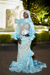 Light Blue Modest Muslim Mermaid Prom Dress High Neck Long Bell Sleeve Structured Cape Gold Crystal Fringe Tassel Gold Baroque Scroll Lace Rhinestone Embroidered Bodice Skirt Tiered Ruffle Hem Sweep Train Gown