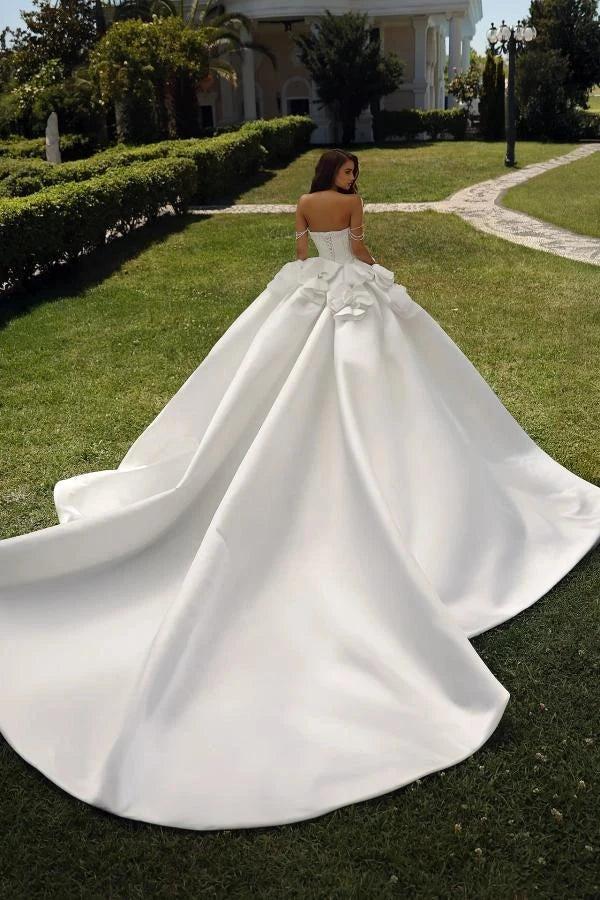 White Satin Ball Gown Wedding Dress Off-the-Shoulder Sweetheart Crystal Pearl Beaded Corset Bodice Boning Detail Crystal Pearl Chain Straps Oversized 3D Satin Flower Thigh-High Slit Royal Cathedral Train Bridal Gown