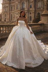 White Satin Ball Gown Wedding Dress Strapless Straight Neckline Oversized Bow Back Princess Bridal Gown with Cathedral Train