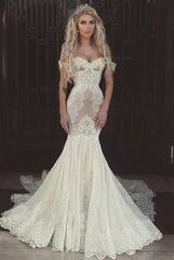 Ivory off-the-shoulder applique mermaid wedding dress
