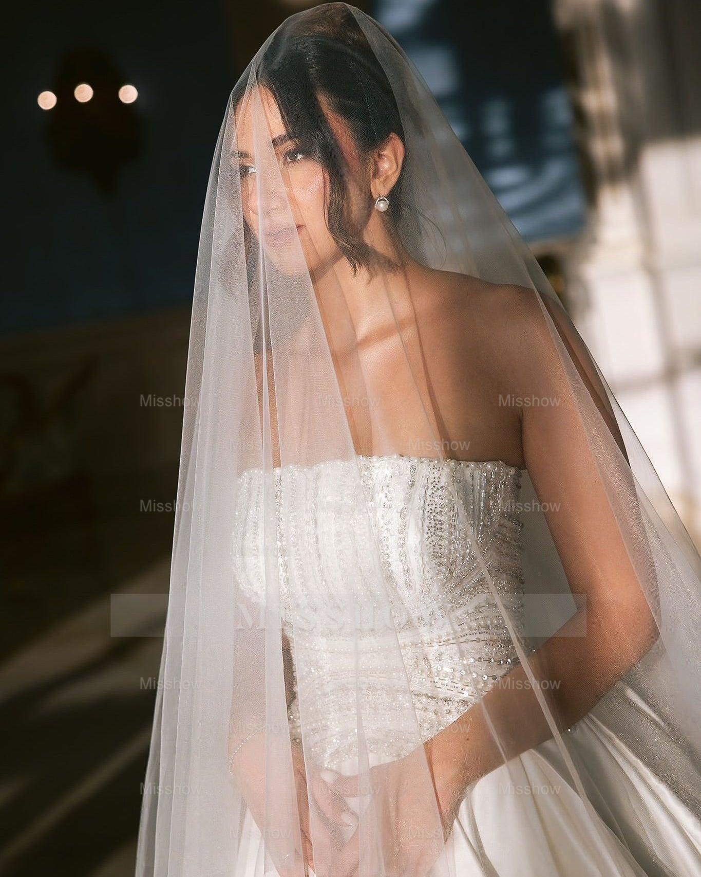 White strapless beaded ball gown wedding dress