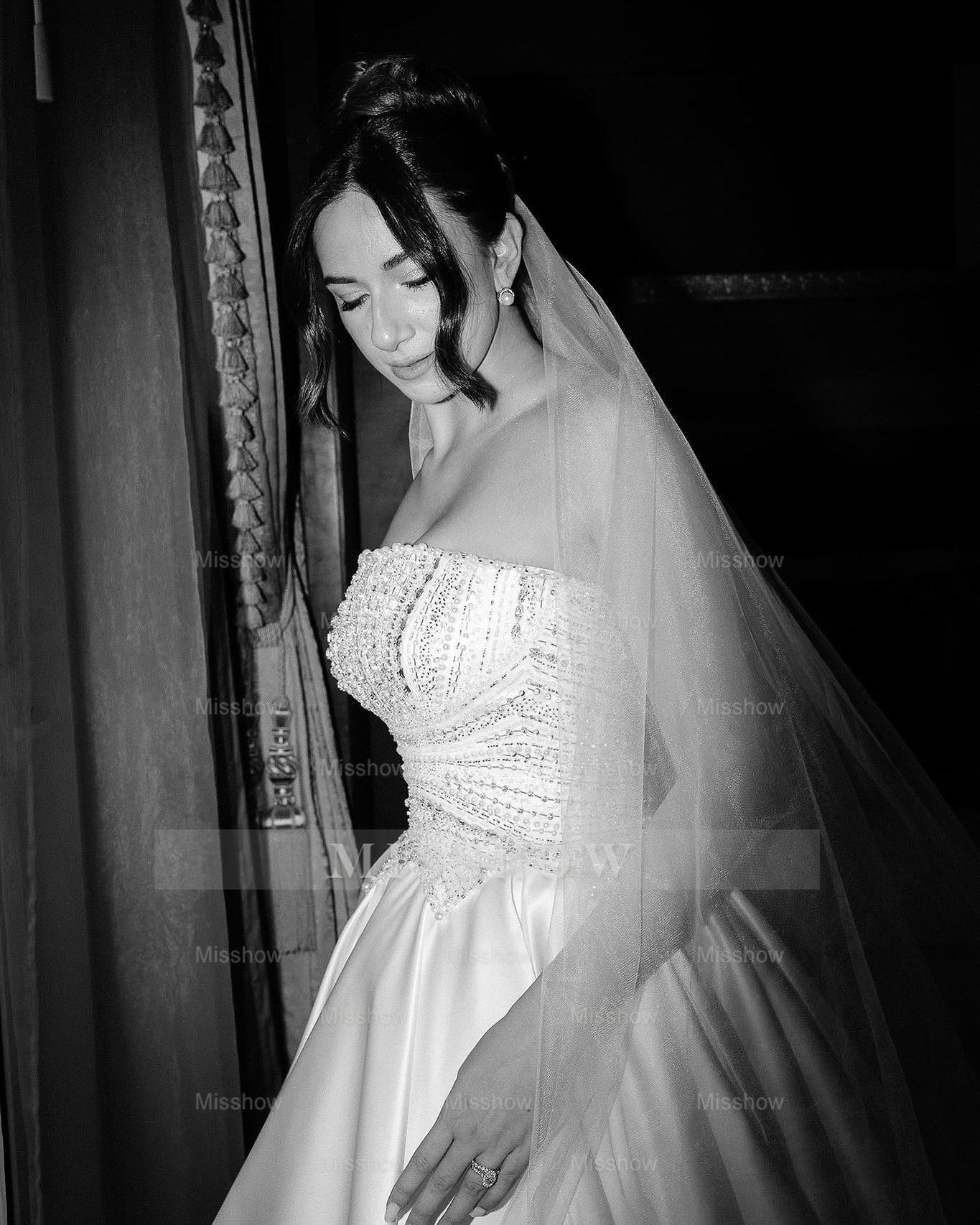 White strapless beaded ball gown wedding dress