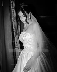 White strapless beaded ball gown wedding dress