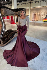 Burgundy Satin Mermaid Evening Dress Square Neck Long Sheer Illusion Sleeves Allover Silver Crystal 3D Floral Lace Beaded Corset Bodice Oversized Front Bow Ruched Waist Cathedral Train Formal Gown