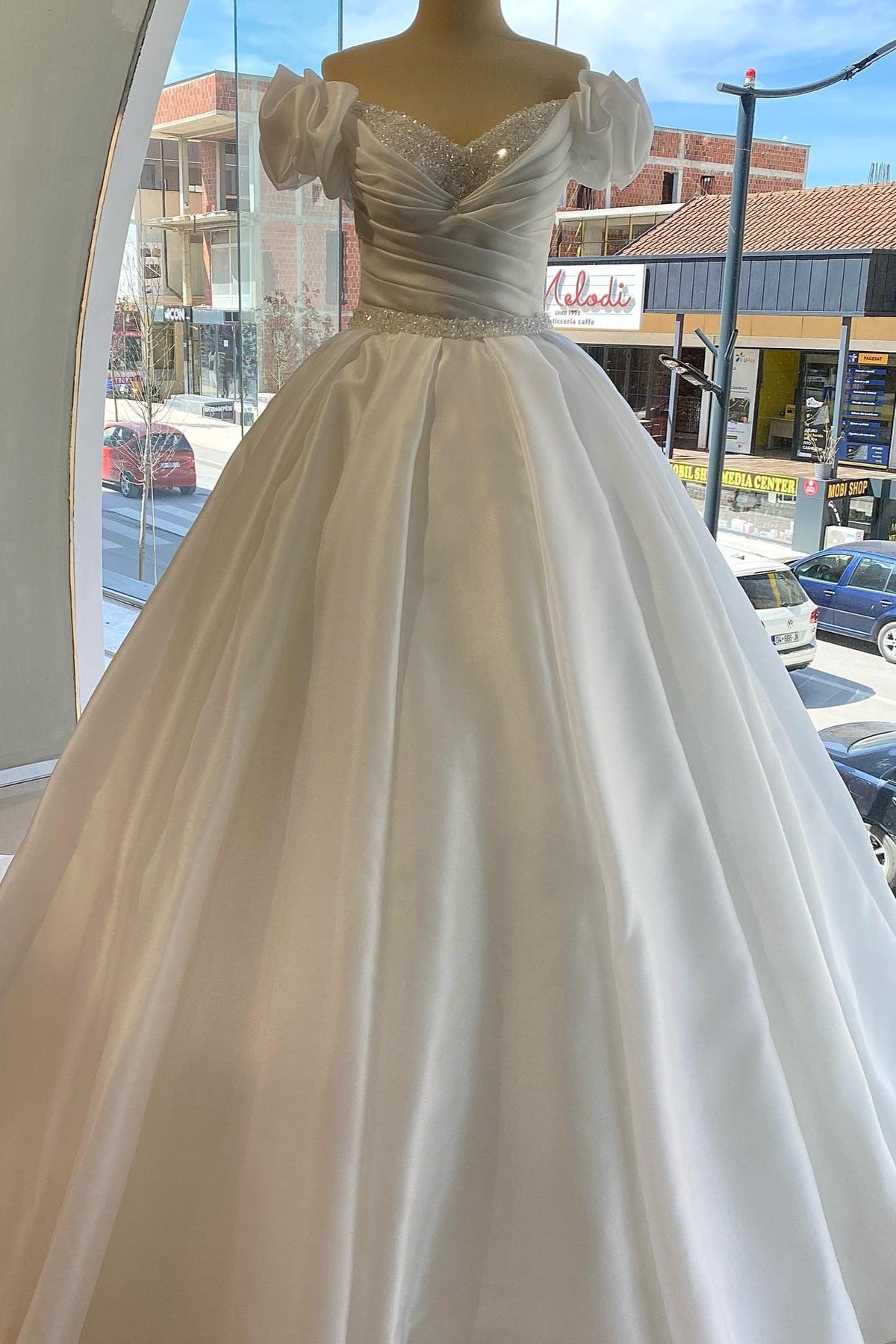 White off-the-shoulder beaded ball gown wedding dress