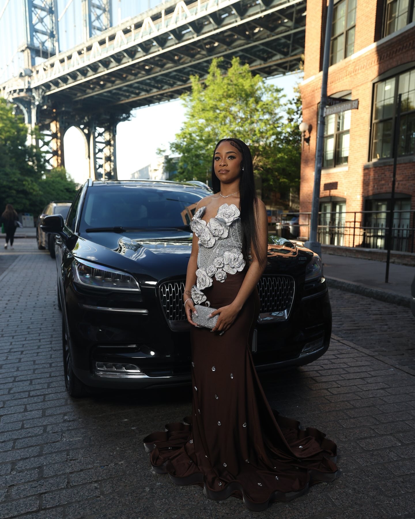 Chocolate Brown Mermaid Prom Dress Strapless Sweetheart Sheer Illusion Heavy Silver Crystal Rhinestone Beading Oversized 3D White Silver Satin Rose Bloom Bodice Scattered Rhinestone Ruffle Hem Sweep Train Gown