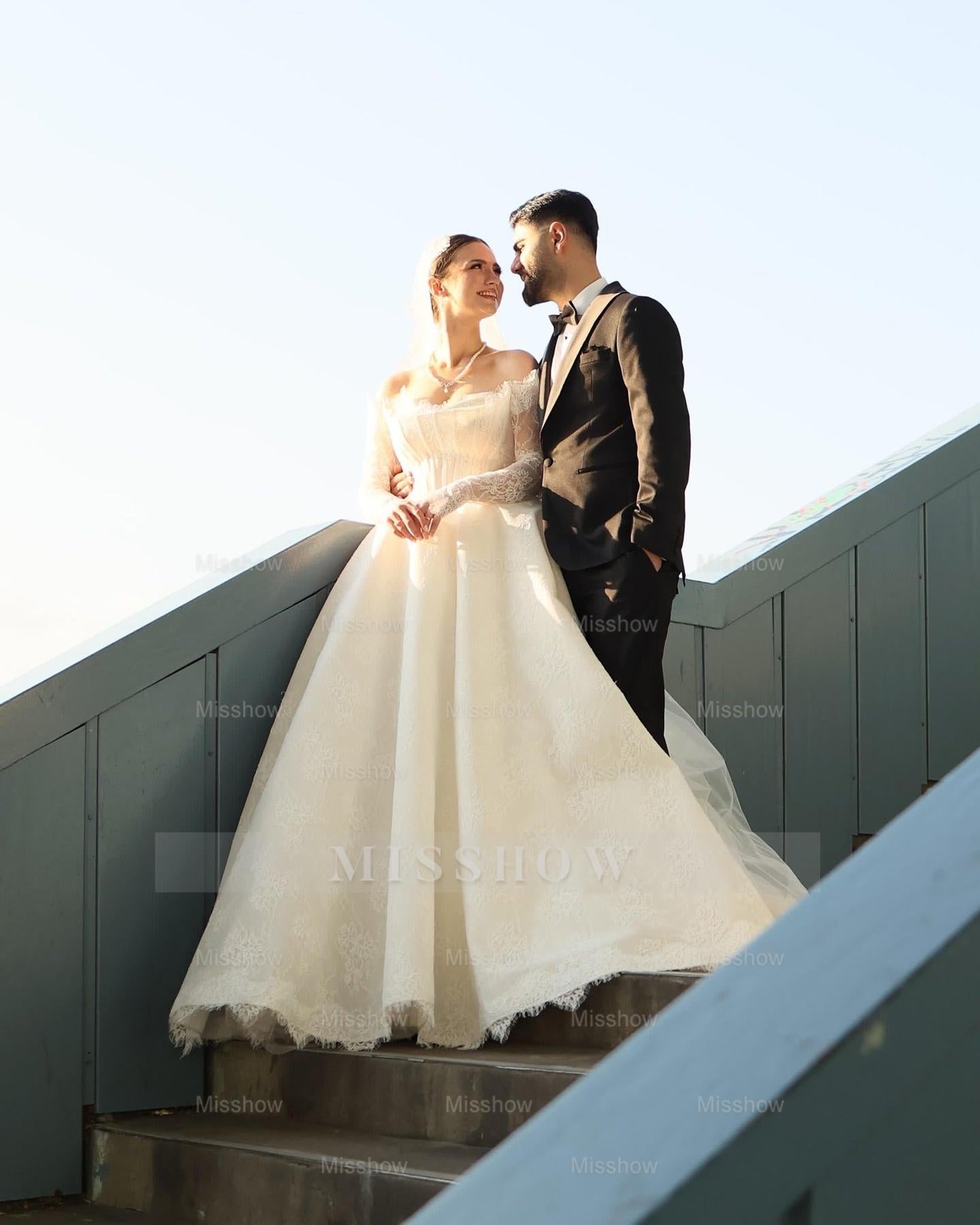 Elegant Ivory Strapless Long-Sleeve Ball Gown Wedding Dress with Chapel Train