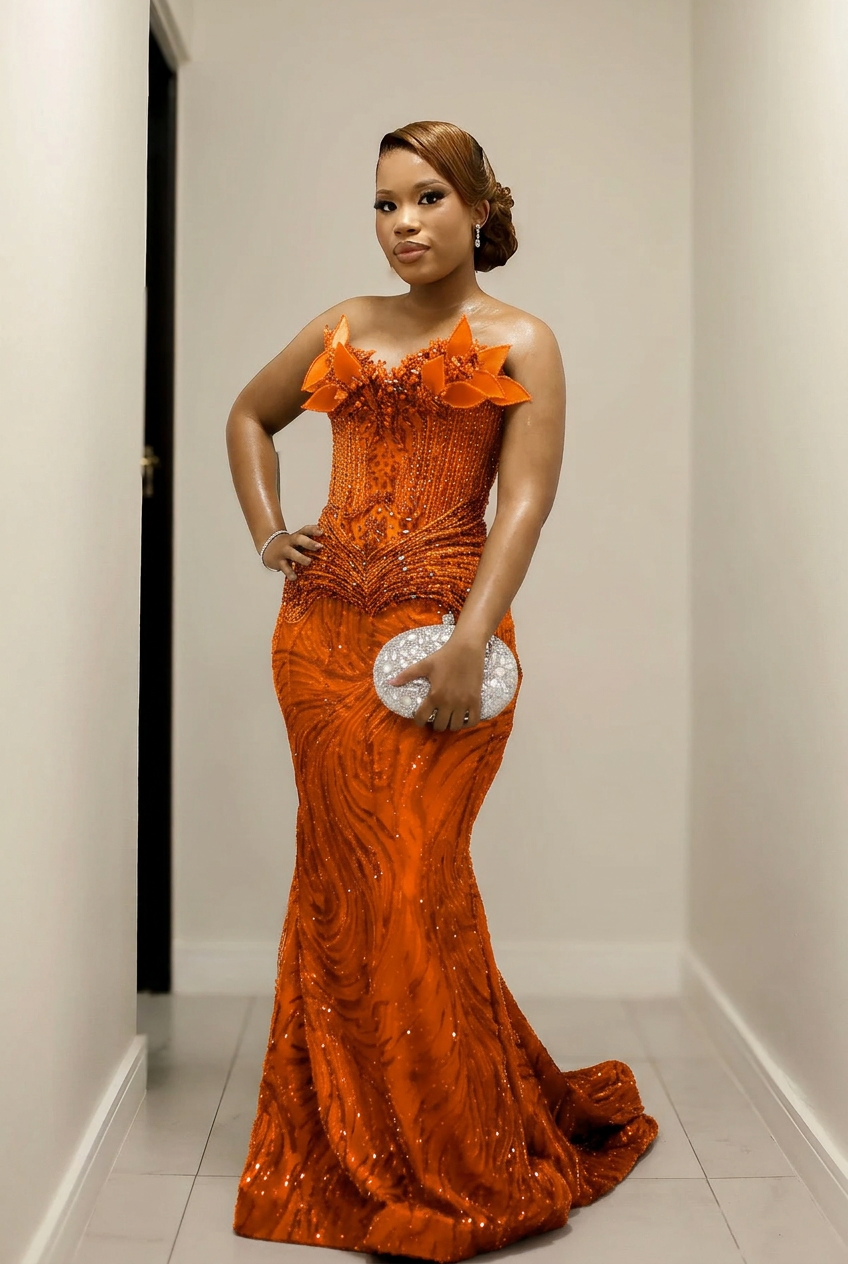 Orange strapless beaded mermaid prom dress