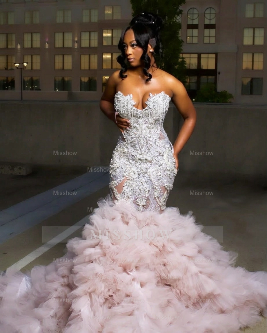 Blushing pink strapless ruffled mermaid prom dress