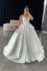 Graceful Ivory V-Neck Sleeveless Ball Gown Wedding Dress with Ruffles