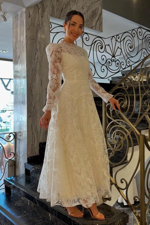 Ivory A-Line Wedding Dress High Neck Pearl Button Long Sheer Lace Sleeves Ruffle Cuff Allover Lace Victorian Modest Bridal Gown