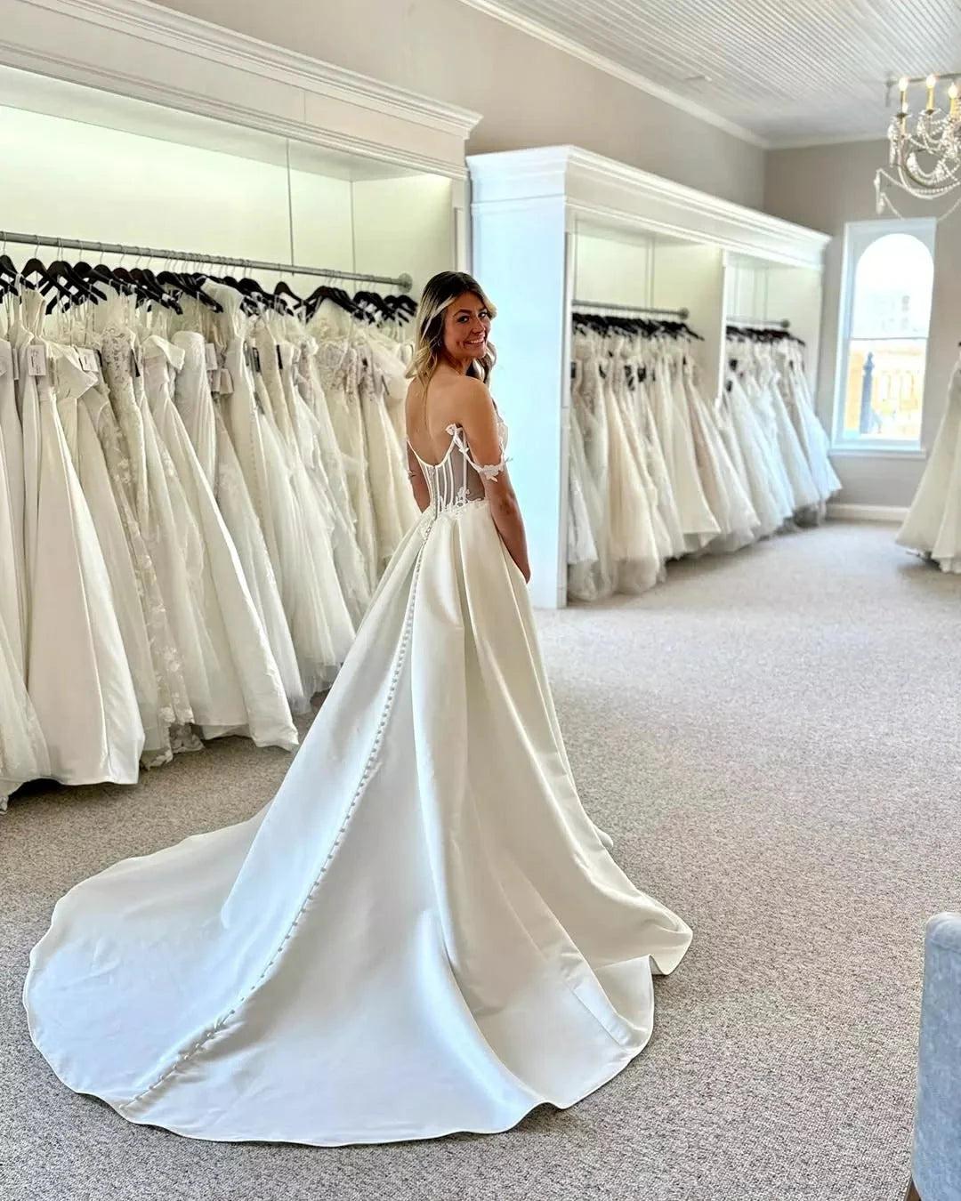 Ivory Satin A-line Wedding Dress Off-the-shoulder Sweetheart Corset Bodice Lace Applique Button Back Cathedral Train Bridal Gown
