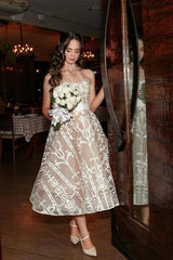 Ivory Tea Length Wedding Dress Strapless Sweetheart Sheer Illusion Boned Corset All-Over Ivory Baroque Scroll Vine Lace Embroidery Lace-Up Back White Satin Bow Waist Sash A-Line Bridal Gown