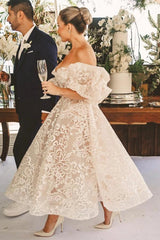 Ivory Tea Length Wedding Dress Strapless Sweetheart Sheer Illusion Boned Corset All-Over Ivory Gold Baroque Scroll Vine Lace Embroidery Thin White Satin Waist Sash Detachable Oversized Off Shoulder Tulle Puff Sleeve Multi-Tier Ruffle A-Line Bridal Gown