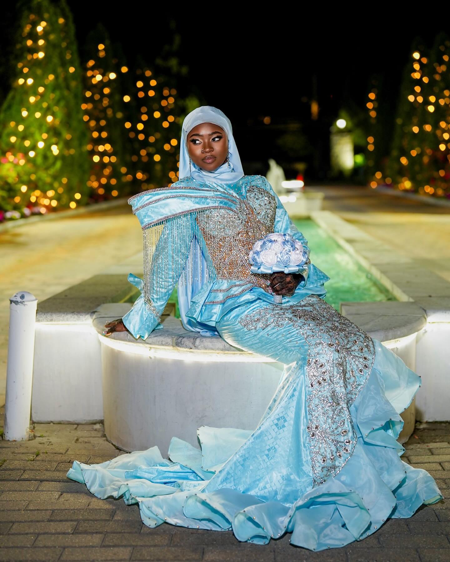 Light Blue Modest Muslim Mermaid Prom Dress High Neck Long Bell Sleeve Structured Cape Gold Crystal Fringe Tassel Gold Baroque Scroll Lace Rhinestone Embroidered Bodice Skirt Tiered Ruffle Hem Sweep Train Gown