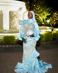 Light Blue Modest Muslim Mermaid Prom Dress High Neck Long Bell Sleeve Structured Cape Gold Crystal Fringe Tassel Gold Baroque Scroll Lace Rhinestone Embroidered Bodice Skirt Tiered Ruffle Hem Sweep Train Gown