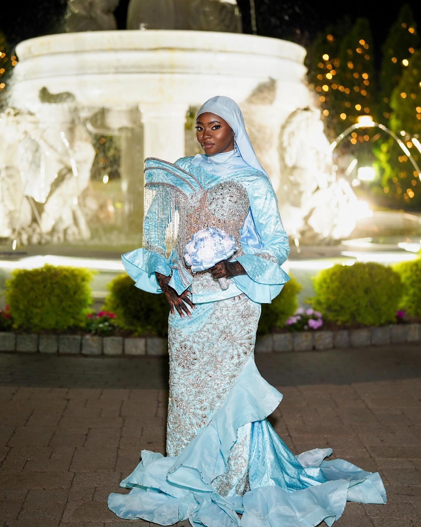 Light Blue Modest Muslim Mermaid Prom Dress High Neck Long Bell Sleeve Structured Cape Gold Crystal Fringe Tassel Gold Baroque Scroll Lace Rhinestone Embroidered Bodice Skirt Tiered Ruffle Hem Sweep Train Gown