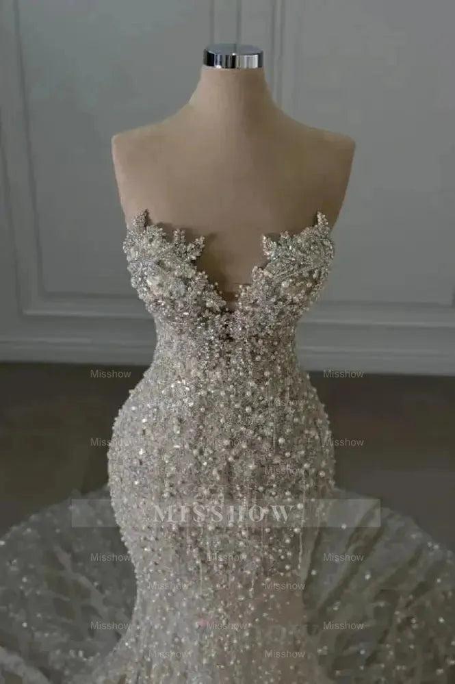 Luxurious Ivory Sweetheart Mermaid Wedding Dress with Beaded Lace and Sequins - Sleeveless Bridal Gown
