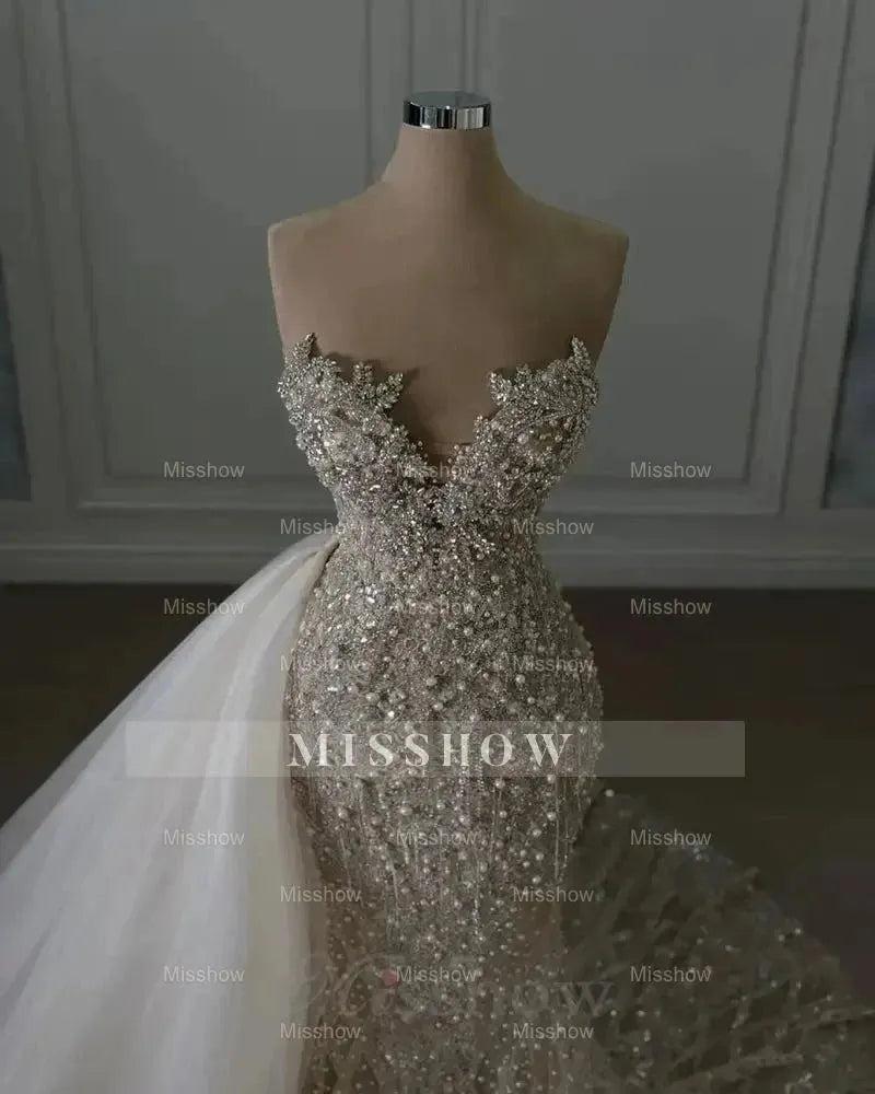 Luxurious Ivory Sweetheart Mermaid Wedding Dress with Beaded Lace and Sequins - Sleeveless Bridal Gown