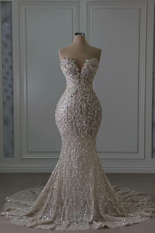 Luxurious Ivory Sweetheart Mermaid Wedding Dress with Beaded Lace and Sequins - Sleeveless Bridal Gown