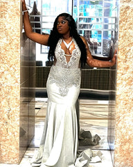 Silver Plus Size Mermaid Prom Dress Deep V Plunge Halter Neck Sheer Illusion Boned Corset Silver Baroque Scroll Vine Lace Embroidery Large Rhinestone Crystal Cluster Silver Bugle Bead Fringe Tassel Side Cutout Silver Shimmer Stretch Satin Court Train Gown