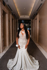 Silver Plus Size Mermaid Prom Dress Deep V Plunge Halter Neck Sheer Illusion Boned Corset Silver Baroque Scroll Vine Lace Embroidery Large Rhinestone Crystal Cluster Silver Bugle Bead Fringe Tassel Side Cutout Silver Shimmer Stretch Satin Court Train Gown