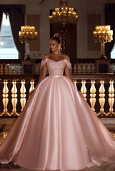 Blushing pink off-the-shoulder sequin A-line wedding dress