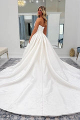 White Jacquard Satin Ball Gown Wedding Dress Strapless Straight Neckline Tone-on-Tone Floral Vine Embroidery Corset Bodice Pearl Button Back Cathedral Train Bridal Gown