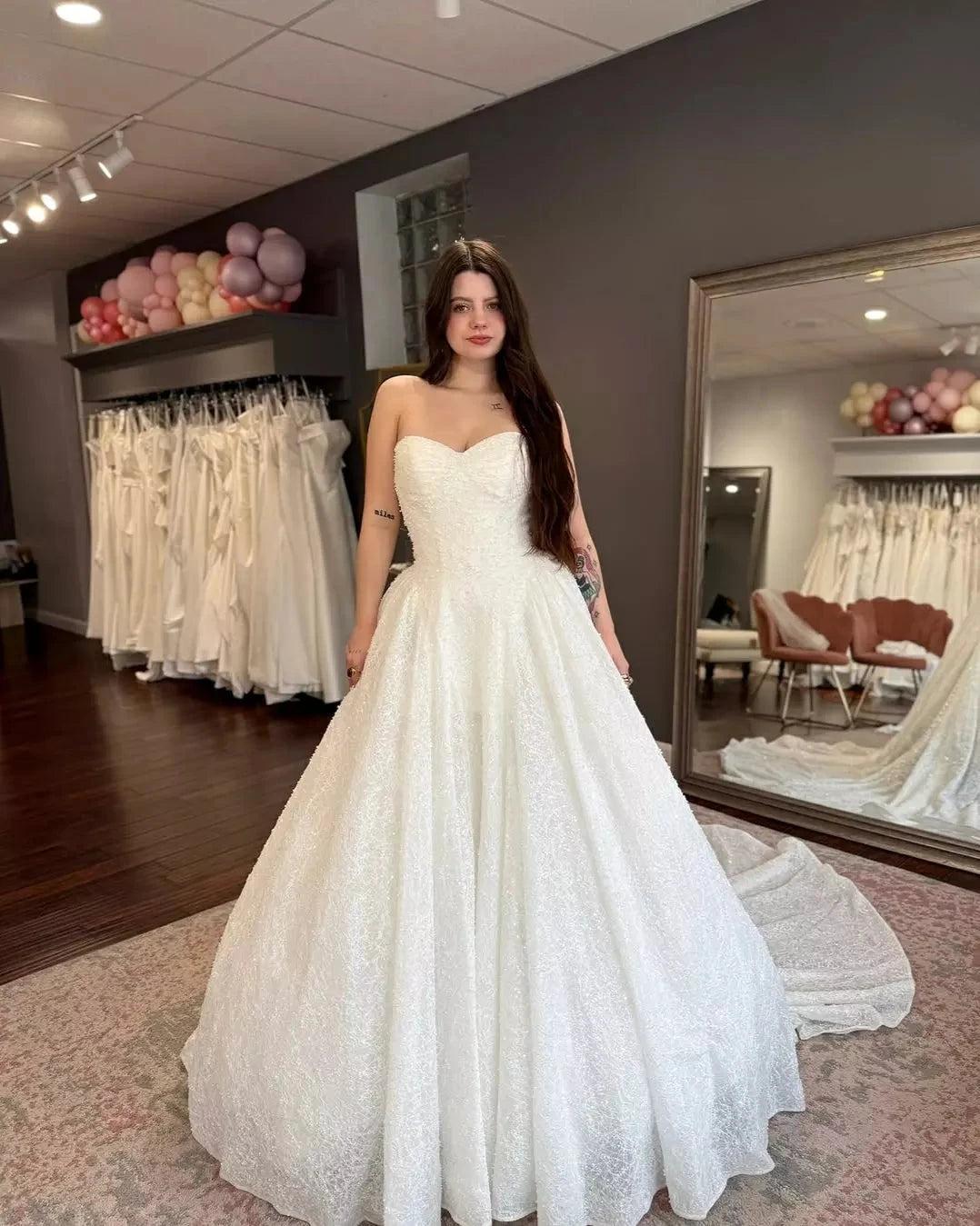 White Lace Beaded Ball Gown Wedding Dress Sweetheart Sleeveless Sparkle Open Back Cathedral Train Bridal Gown