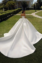 White Satin Ball Gown Wedding Dress Off-the-Shoulder Sweetheart Crystal Pearl Beaded Corset Bodice Boning Detail Crystal Pearl Chain Straps Oversized 3D Satin Flower Thigh-High Slit Royal Cathedral Train Bridal Gown