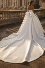 White Satin Ball Gown Wedding Dress Strapless Straight Neckline Oversized Bow Back Princess Bridal Gown with Cathedral Train
