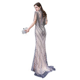 The gorgeous Cap Sleeves High Neck Sparkly Beads Floor-Length Mermaid Evening Party Gown will stun every girl. The Tulle Vintage Party dress will add extra elegance to your wholesale look.