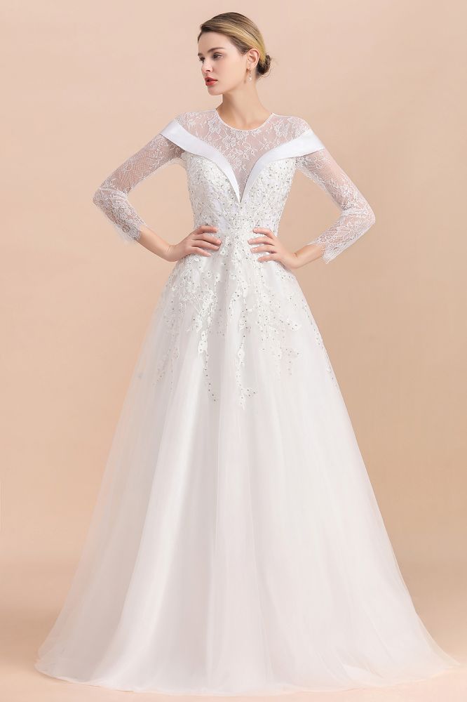 Looking for  in Tulle, A-line style, and Gorgeous Lace,Rhinestone work  MISSHOW has all covered on this elegant Modest White Beaded Appliques Wedding Dress Long Sleeve Floor Length Ball Gown
