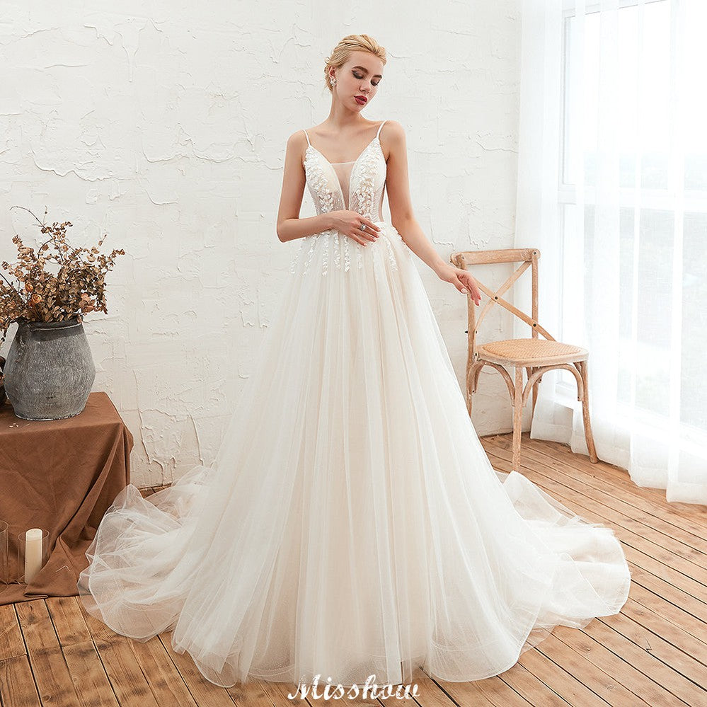 Looking for  in Tulle, A-line,Ball Gown style, and Gorgeous Beading,Flower(s) work  MISSHOW has all covered on this elegant Spaghetti Straps Plunging V-Neck Wedding Dress Low Back Champagne Bridal Gown