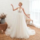 Looking for  in Tulle, A-line,Ball Gown style, and Gorgeous Beading,Flower(s) work  MISSHOW has all covered on this elegant Spaghetti Straps Plunging V-Neck Wedding Dress Low Back Champagne Bridal Gown
